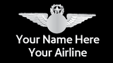 A badge featuring an airplane design with a placeholder for a custom name, and text indicating 'Your Name Here'.


